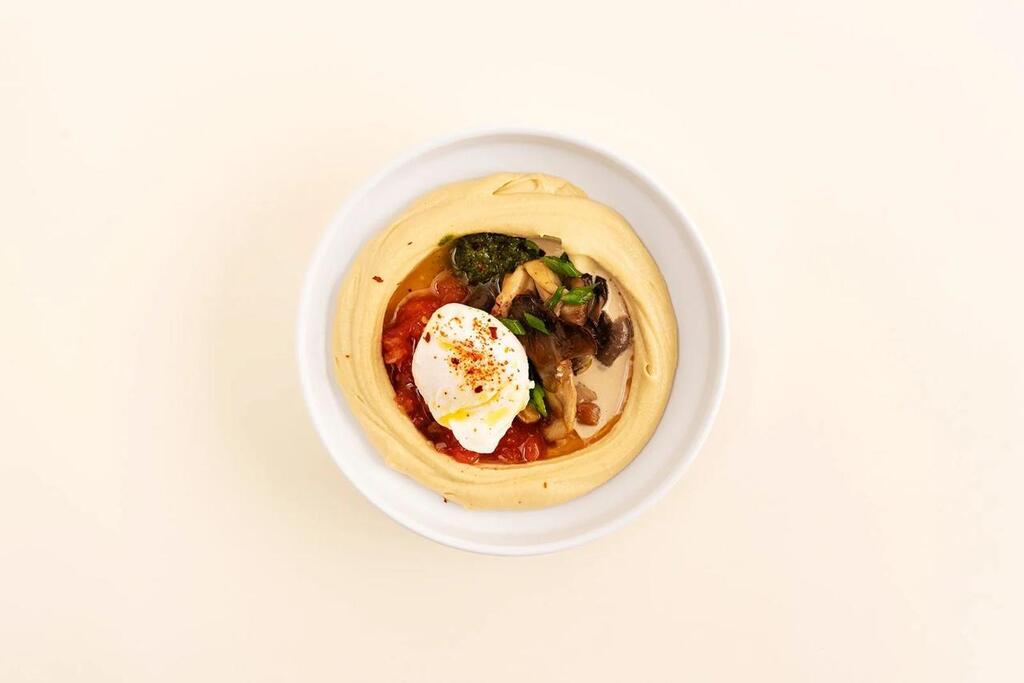 Hummus topped with a poached egg, mushrooms and vegetables at Safta's Table (Photo: Safta's Table) Hummus topped with a poached egg, mushrooms and vegetables at Safta's Table