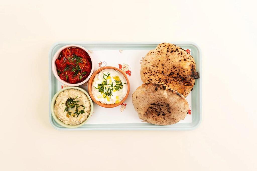 Freshly baked pita served with a selection of dips and spreads at Safta's Table (Photo: Safta's Table) Freshly baked pita served with a selection of dips and spreads at Safta's Table