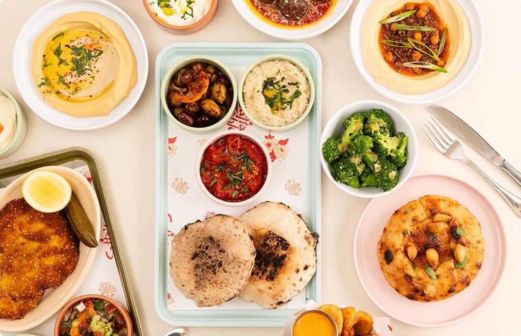 A selection of Israeli-inspired dishes at Safta's Table in New Orleans, including hummus, pita, schnitzel and vegetable sides (Photo: Safta's Table) A selection of Israeli-inspired dishes at Safta's Table in New Orleans, including hummus, pita, schnitzel and vegetable sides