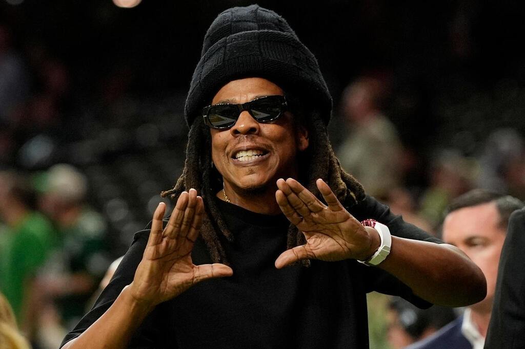 Jay-Z gestures from the sidelines prior to the NFL Super Bowl 59 football game, Feb. 9, 2025, in New Orleans 
