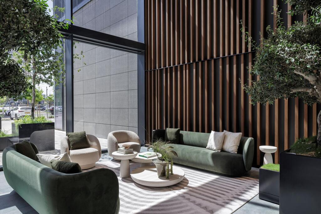 SEA ONE's entrance lounge combines contemporary furnishings, natural light and greenery in a hotel-inspired residential setting (Photo: Eran Turgeman) SEA ONE's entrance lounge combines contemporary furnishings, natural light and greenery in a hotel-inspired residential setting