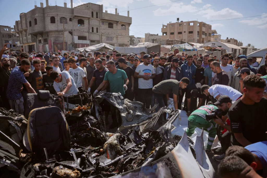 Palestinians inspect the wreckage of a vehicle destroyed by an Israeli airstrike on the Maghazi refugee camp in the central Gaza Strip on Thursday (Photo: AP) Palestinians inspect the wreckage of a vehicle destroyed by an Israeli airstrike on the Maghazi refugee camp in the central Gaza Strip on Thursday
