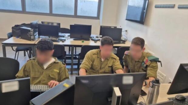 IDF soldiers work together at computer stations during a training exercise simulating the development and defense of military technology systems (Photo: IDF) IDF soldiers work together at computer stations during a training exercise simulating the development and defense of military technology systems
