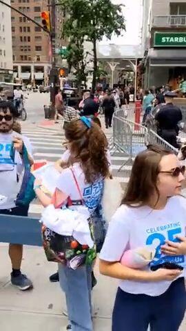 Young participants gather outside a security checkpoint