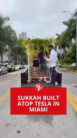 A SUKKAH BUILT ATOP A TESLA IN MIAMI