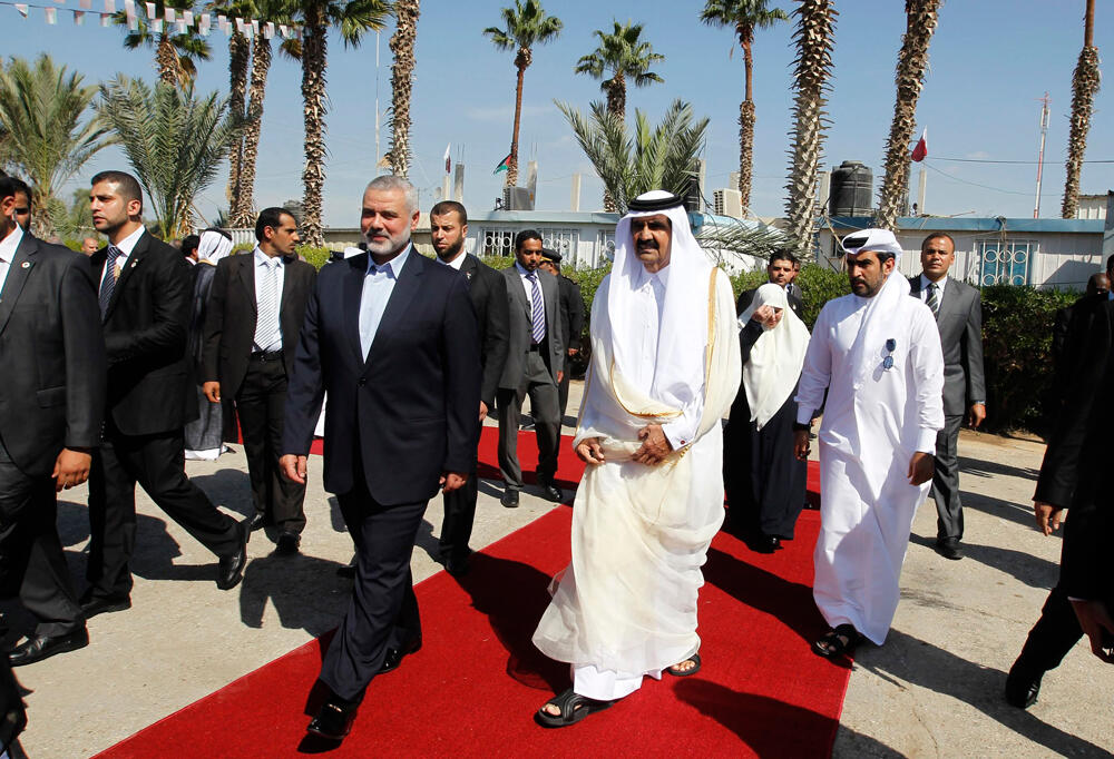 Qatari Emir Sheikh Hamad bin Khalifa al-Thani with Hamas leader Ismail Haniyeh in Gaza, October 23, 2012 