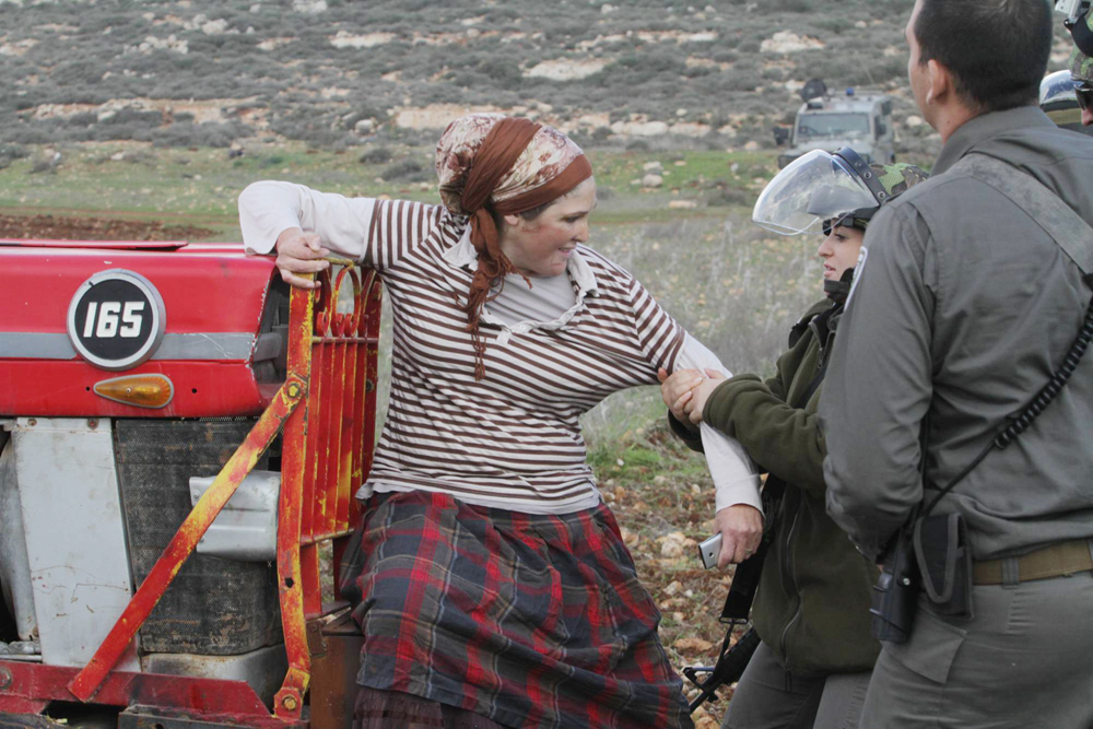 Israeli troops clash with settlers near the illegal West Bank outpost of Esh Kodesh 