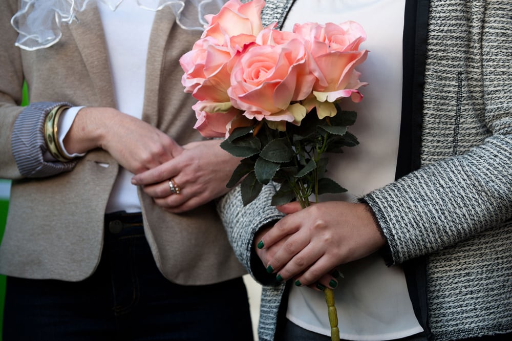 A lesbian couple holds a symbolic wedding ceremony after being denied the right to marry by the state 