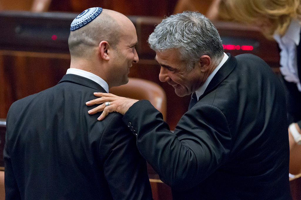 Yamina leader Naftali Bennet and Yesh Atid leader Yair Lapid in the Knesset in 2014 (Photo: EPA) Yamina leader Naftali Bennet and Yesh Atid leader Yair Lapid in the Knesset in 2014