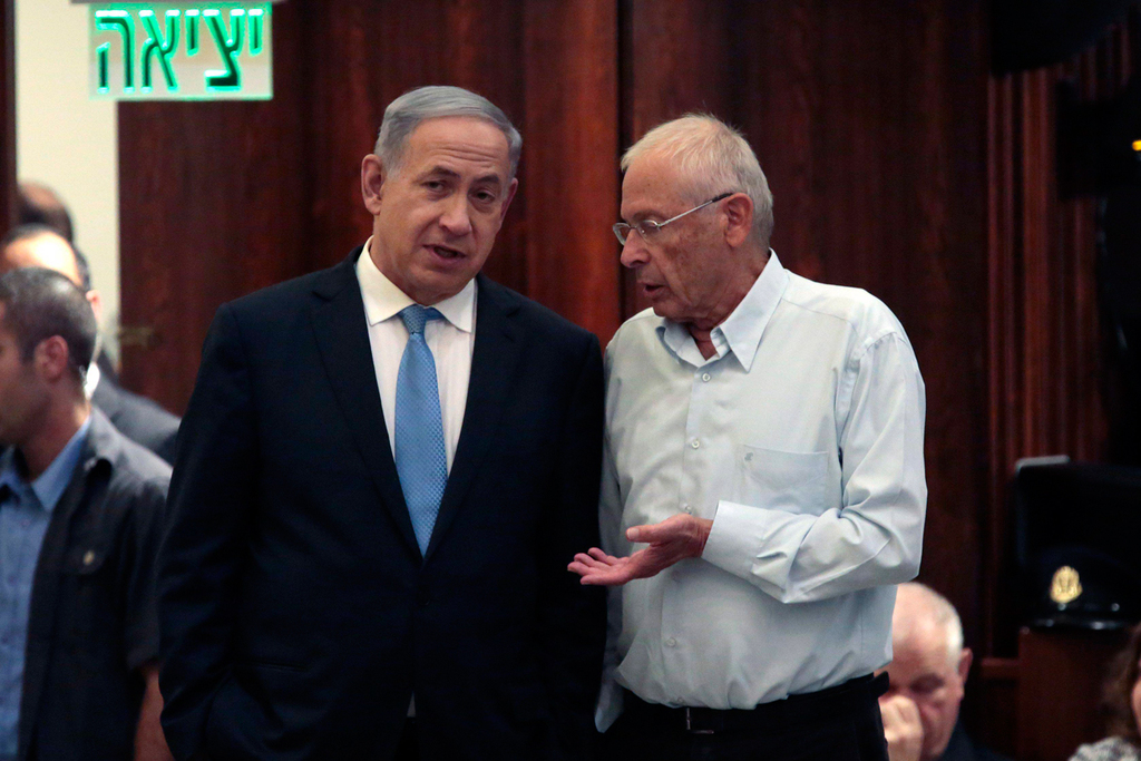 Prime Minister Benjamin Netanyahu and Benny Begin talking in the Knesset's Plenum in 2016 