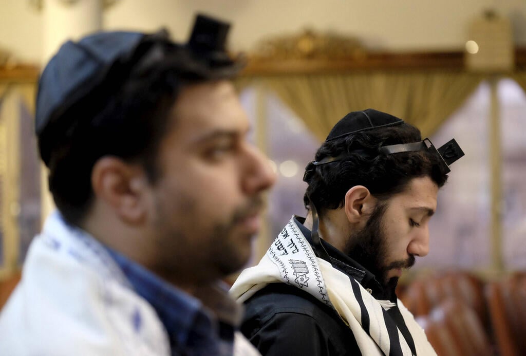 Jewish men praying in Iran (Photo: Reuters) Jewish men praying in Iran
