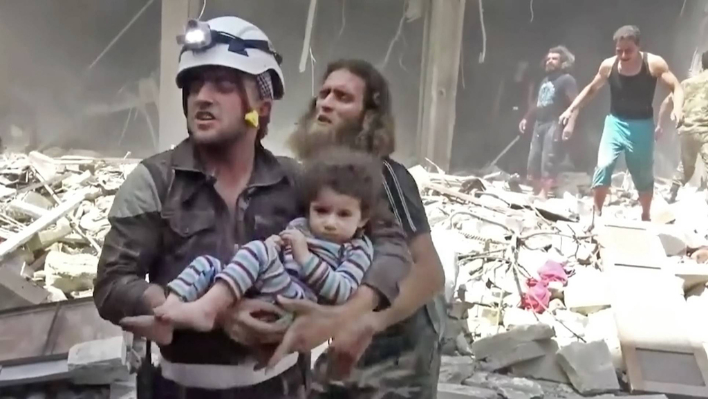 Civilians run from bombs in Aleppo in 2016 during the Syrian civil war 