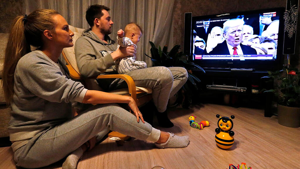 Russian family watching TV 