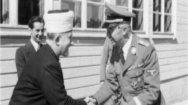 Head of the SS Heinrich Himmler and Mufti Hajj Amin al-Husseini shaking hands