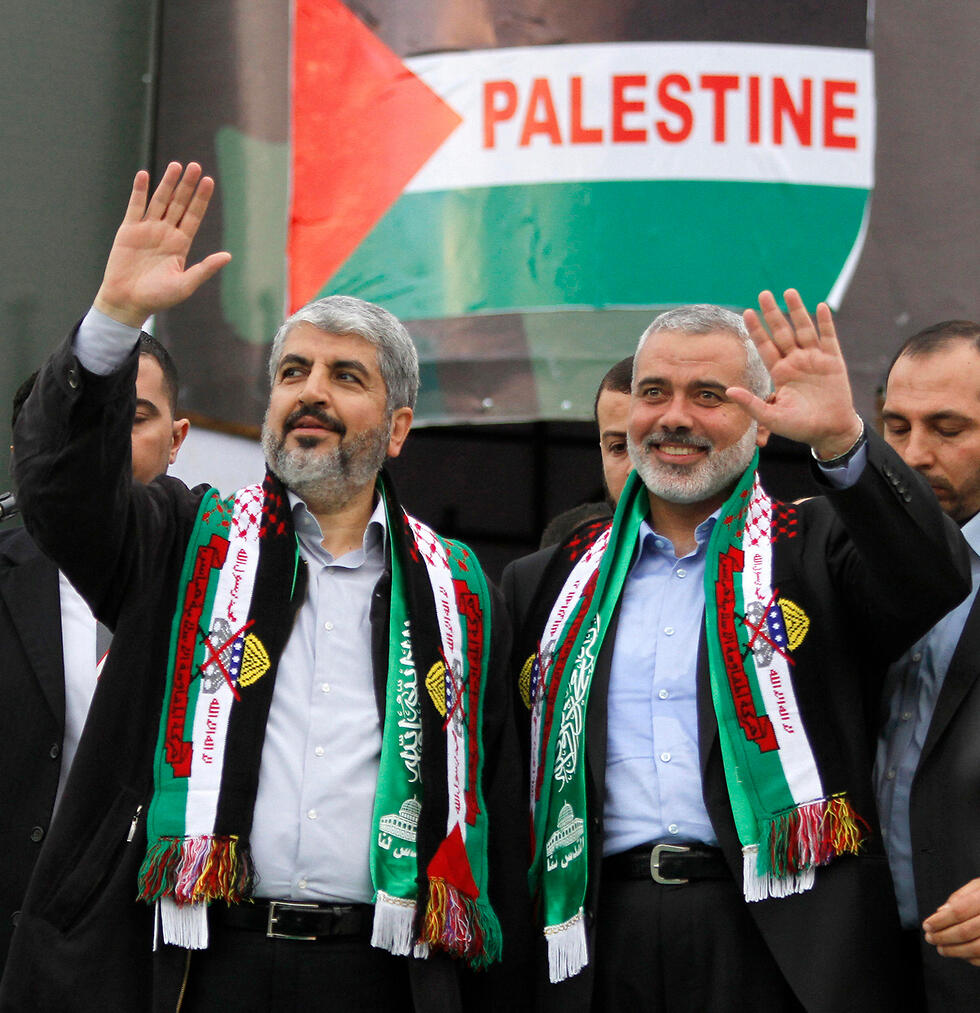 Hamas leaders Khaled Mashal, left, and Ismail Haniyeh 