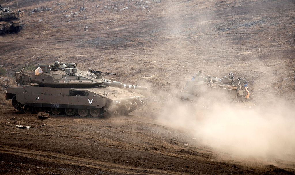 IDF tanks stationed near the border with Syria 
