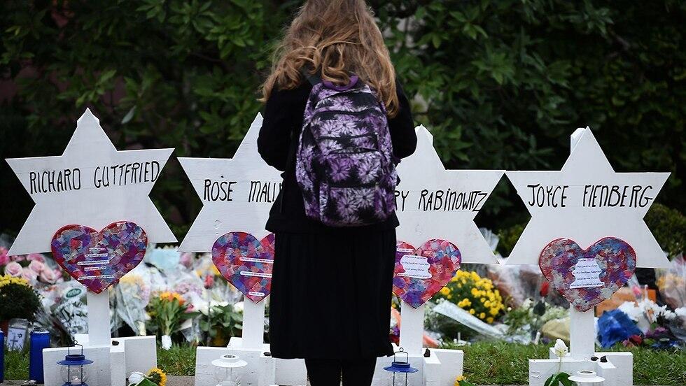 Flowers and signs in memory of the victims of the deadly attack on the Tree of Life synagogue in Pittsburgh in 2018 