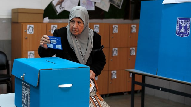 An Israeli woman votes in the Arab city of Taibeh in last year's elections 
