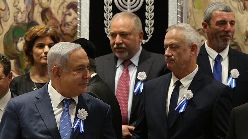 Benjamin Netanyahu and Benny Gantz at the opening of the Knesset earlier this year, with Tamar Zandberg, Avigdor Liberman and Rafi Peretz standing behind them 