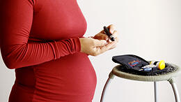 A pregnant woman checks her blood sugar