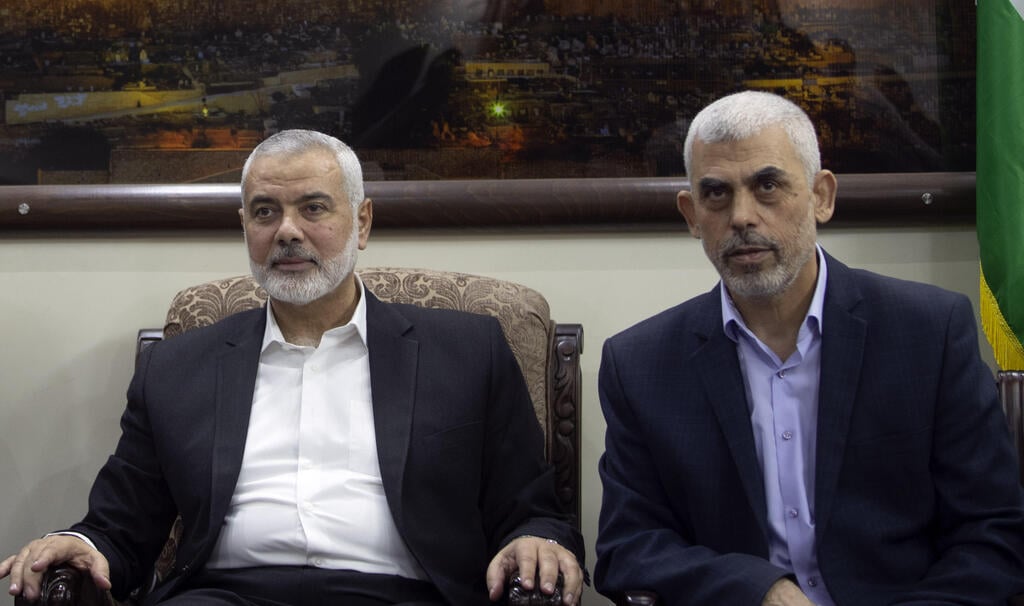 Hamas leader Ismail Haniyeh, left, and the leader of the movement in Gaza Yahya Sinwar (Photo: AP) Head of Palestinian Election Comittee meets Ismail Haniyeh and Yahya Sinwar