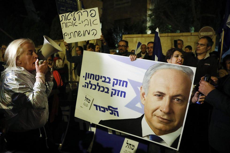 Supporters of Benjamin Netanyahu protest in Jerusalem after he was indicted Thursday 