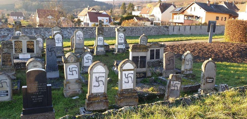 Swastika symbol daubed on graves in a Jewish cemetery in France צלבי קרס על קברים בבית עלמין יהודי בצרפת