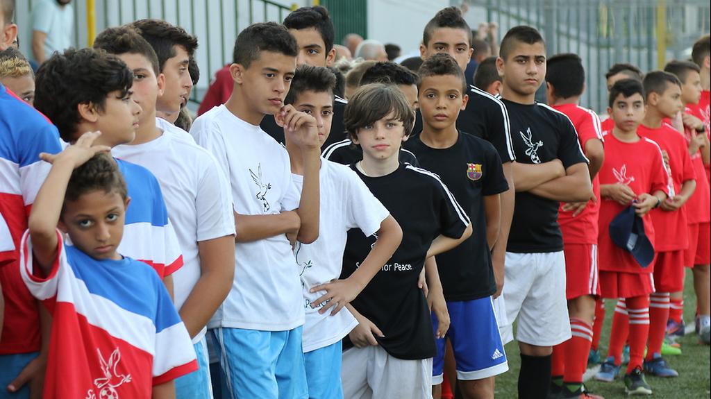Israeli Jewish and Arab kids at soccer match
