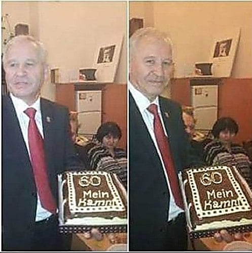 Anti-Semitic Ukrainian diplomat Vasily Marushchinets Marushchinets holding a 'Mein Kampf' cake