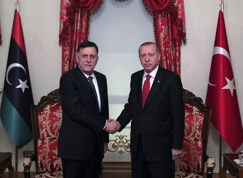 Turkish President Recep Tayyip Erdogan, right, and Libyan leader Fayez al Sarraj 