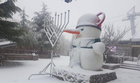 First snowfall of the winter hits north as storm system rips through Israel