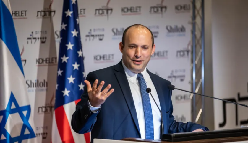 Defense Minister Naftali Bennett speaking at a Kohelet Policy Forum conference  