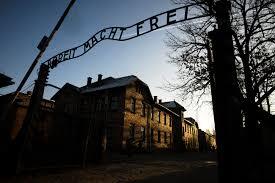 The infamous gates of the Auschwitz death camp in Poland, with the phrase 'work sets free' written across the top in German
(Photo: AP) The Auschwitz death camp