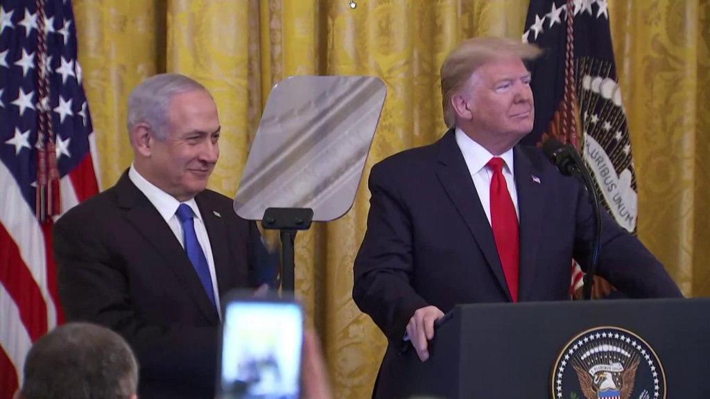 Prime Minister Benjamin Netanyahu looks on as President Donald Trump unveils his Mideast peace plan at the White House, Jan. 28, 2020
(Photo: Reuters) הבית הלבן