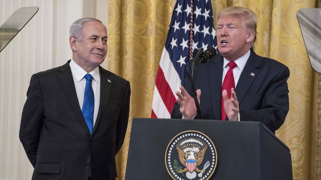 Prime Minister Benjamin Netanyahu watches as President Donald Trump unveils his Mideast peace plan at the White House, Jan. 28, 2020 