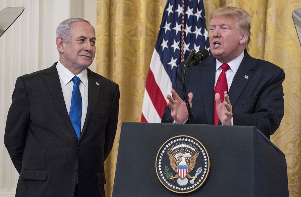 Prime Minster Benjamin Netanyahu watches as U.S. President Donald Trump unveils his Mideast peace plan at the White House in January 