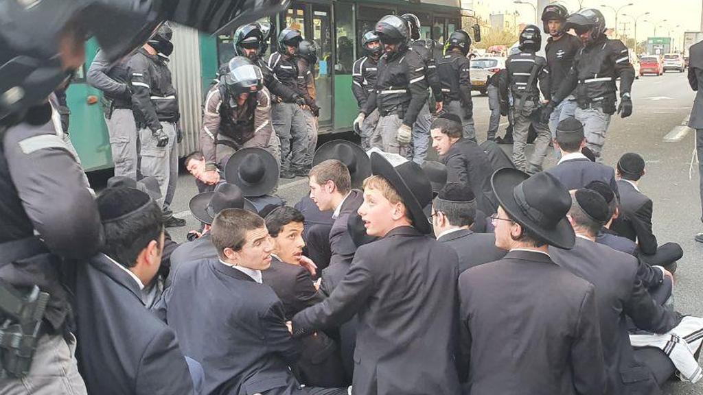 Ultra-Orthodox protesters face off with police over the arrest of a draft dodger הפגנת חרדים נגד מעצרו של דניאל מדהני אשר השתמט מהצבא