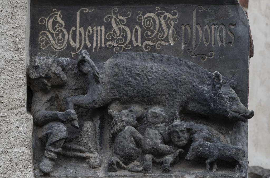 The memorial plaque against anti-semitism underneath the Judensau