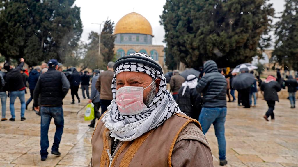  A Muslim worshiper wears a face mask at the Temple Mount in Jerusalem on Friday 