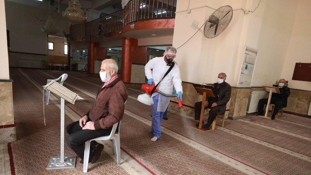 A mosque in Ramallah being disinfected to protect worshippers from the coronavirus at the beginning of the pandemic חיטוי מסגדים ברמאללה