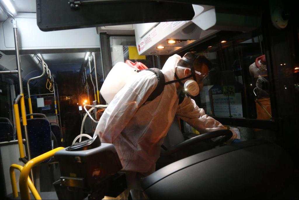 A Tel Aviv bus is disinfected to protect from the coronavirus (Photo: Moti Kimchi) חיטוי אוטובוס של חברת "דן" בעקבות התפשטות נגיף הקורונה בישראל
