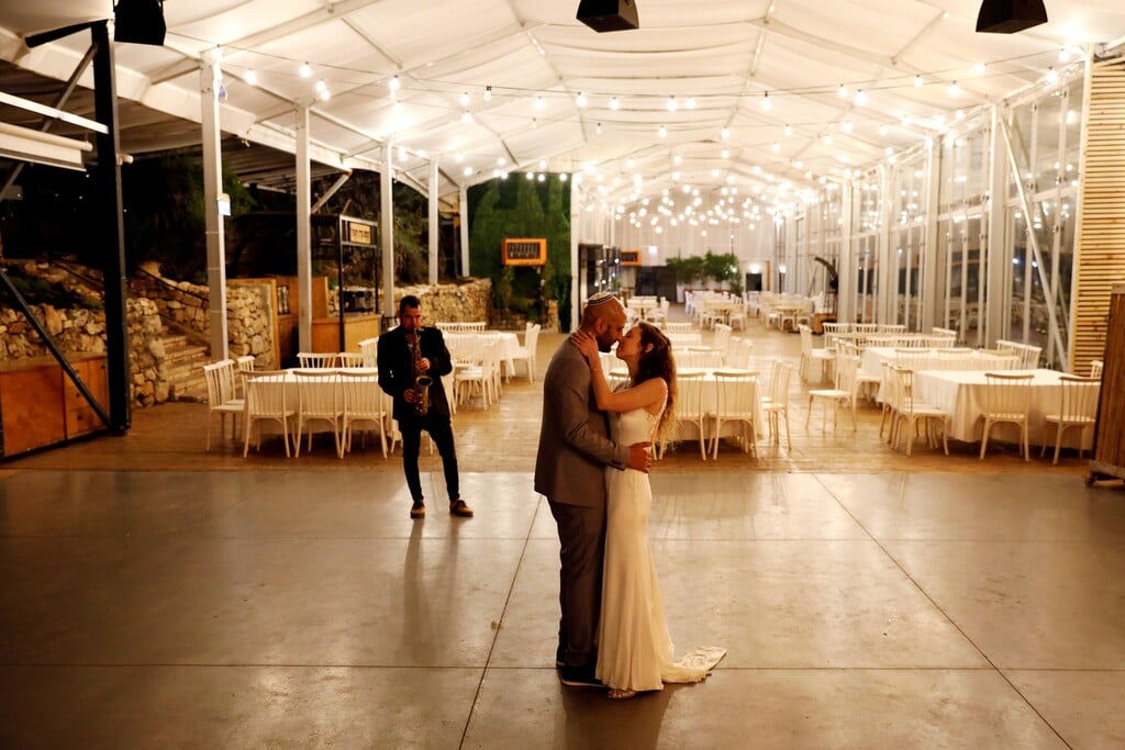 Roni Ben-Ari and Yonatan Meushar dance as they get married at Ein   Hemed Forest Wedding Venue,which is offering free, small scale   ceremonies for young couples whose marriages cannot take place due to coronavirus restrictions 