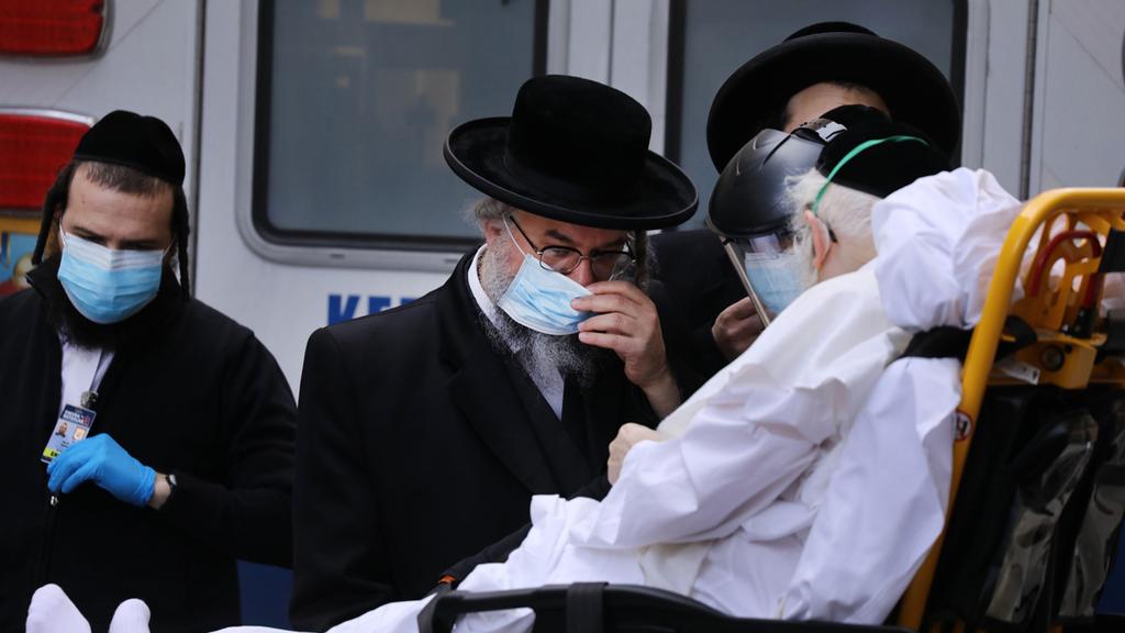 A Haredi coronavirus patient in New York being evacuated to hospital (Photo: AFP) A Haredi coronavirus patient in New York being evacuated to hospital