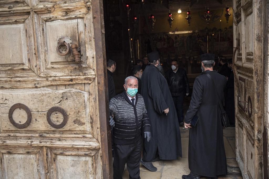 Monks prepare to start a small Palm Sunday procession 