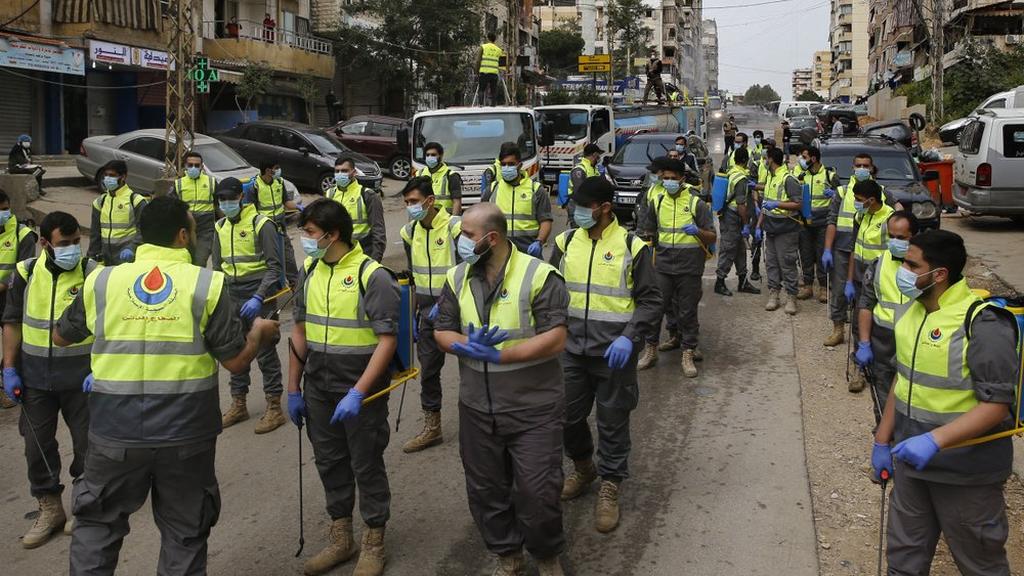 Members of the Islamic Health Society, an arm of Hezbollah prepare to spray disinfectant as a precaution against the coronavirus in Lebanon (Photo: AP) , members of the Islamic Health Society, an arm of the Iran-backed militant Hezbollah group prepare to spray disinfectant as a precaution against the coronavirus