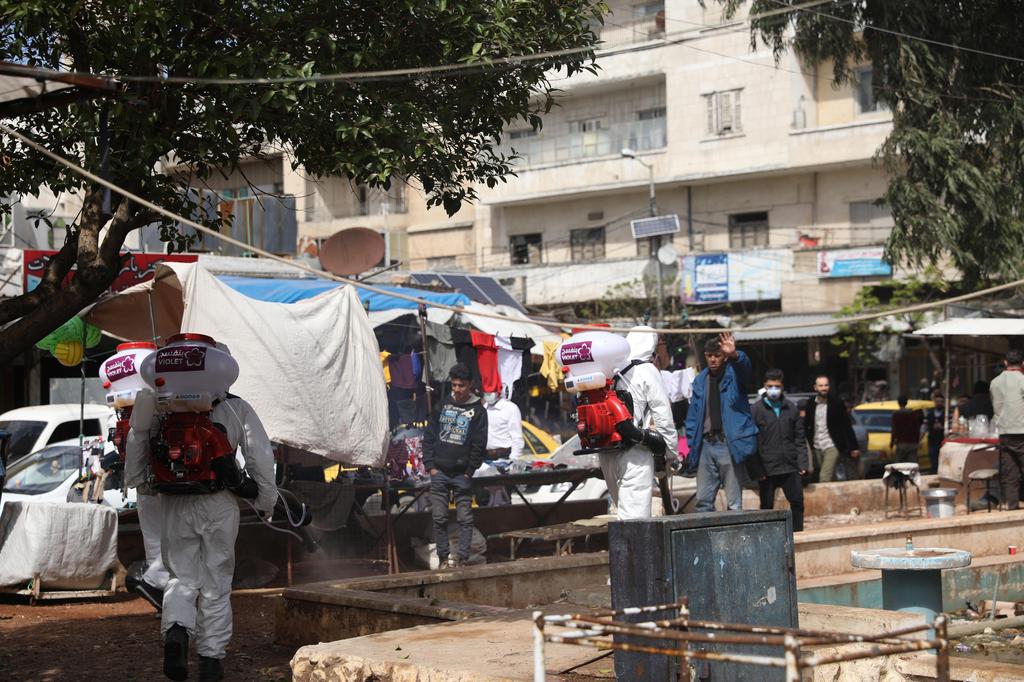 Volunteers from 'Violet Organization' wear personal protective equipment during a disinfection operation in Idlib, Syria (Photo: EPA) Volunteers from 'Violet Organization', a local non government organization, wear personal protective equipment and use equipments during a disinfection operation in Idlib, Syria