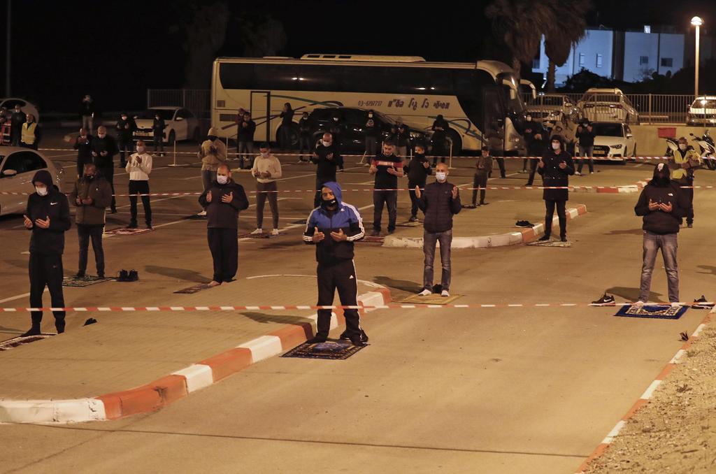 Muslim parishners pray in a parking lot in Jaffa 