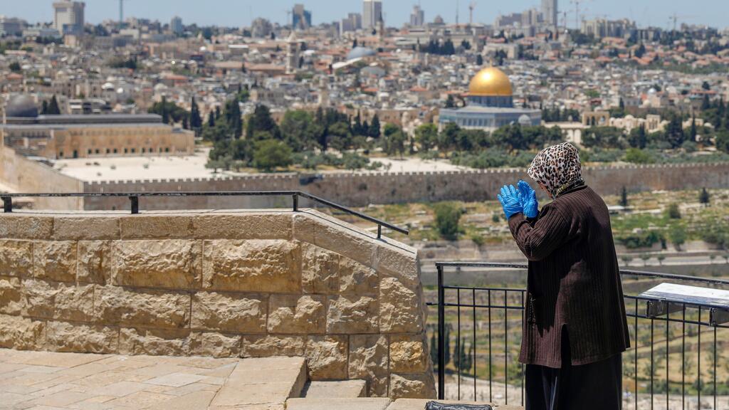 Woman prays in East Jerusalem during Ramadan 