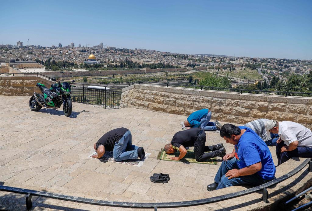 Muslims in East Jerusalem pray outdoors during Ramadan 