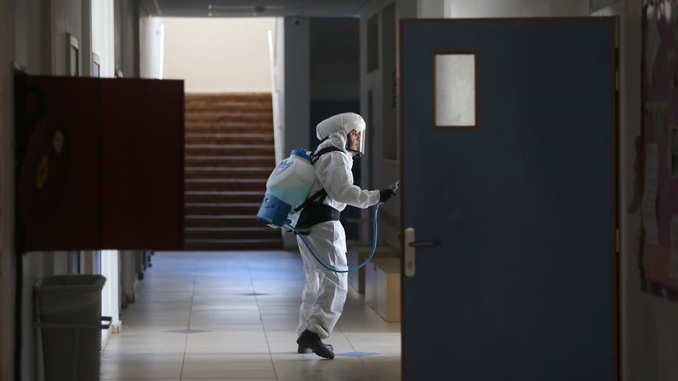 Sanitation worker at Jerusalem's Gymnasia Rehavia where dozens of students and faculty contracted coronavirus 